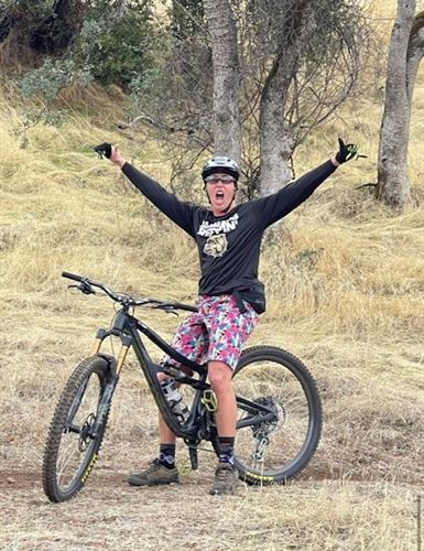 Kelly riding her mountain bike.