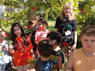 Garden Club Students Holding Flowers